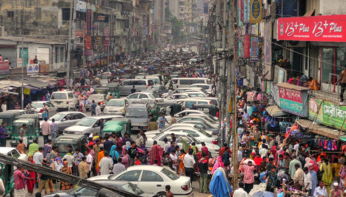 A traffic jam with lots of cars and people